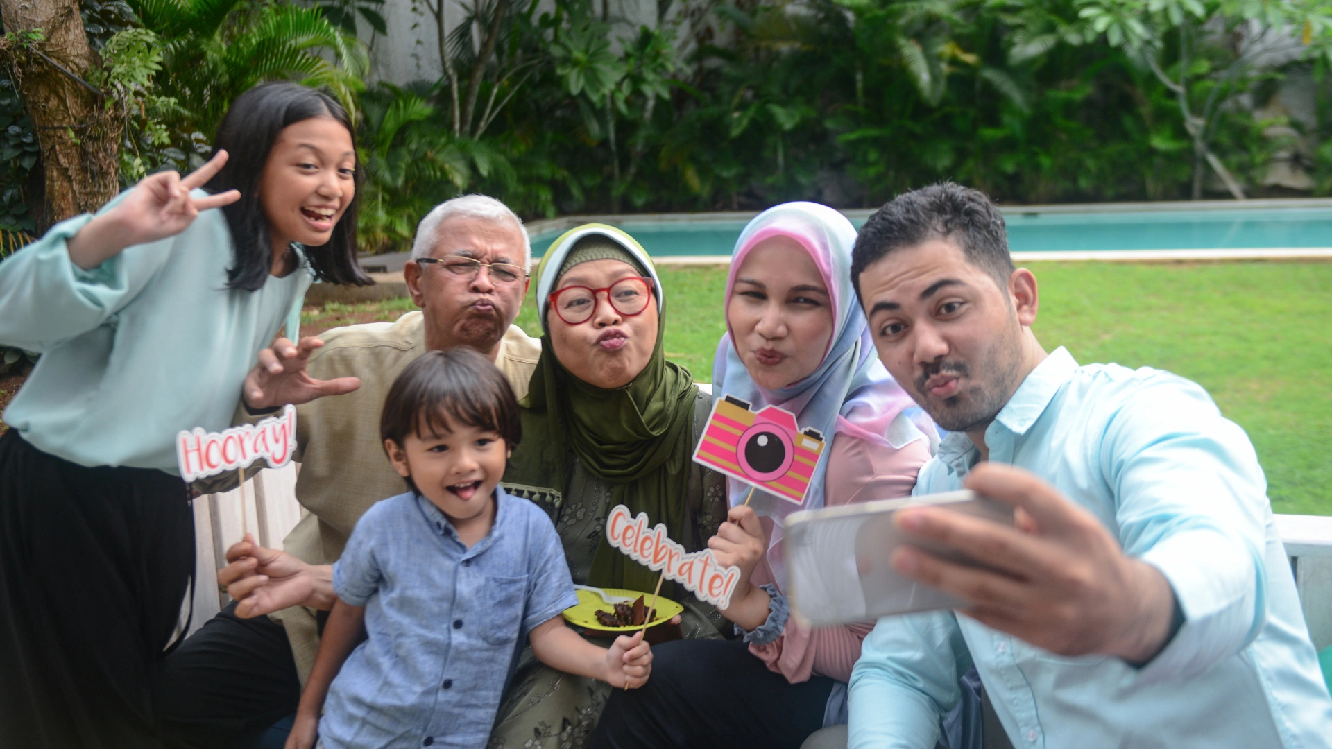 Family taking a fun selfie in their backyard in Trinity Florida