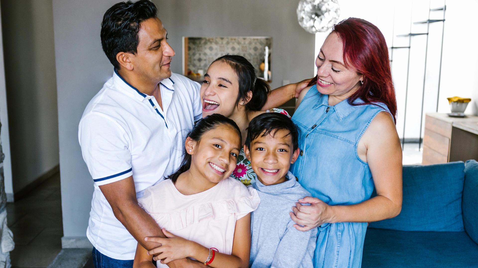 Happy family of five in their clean Lutz home, parents and three children smiling together