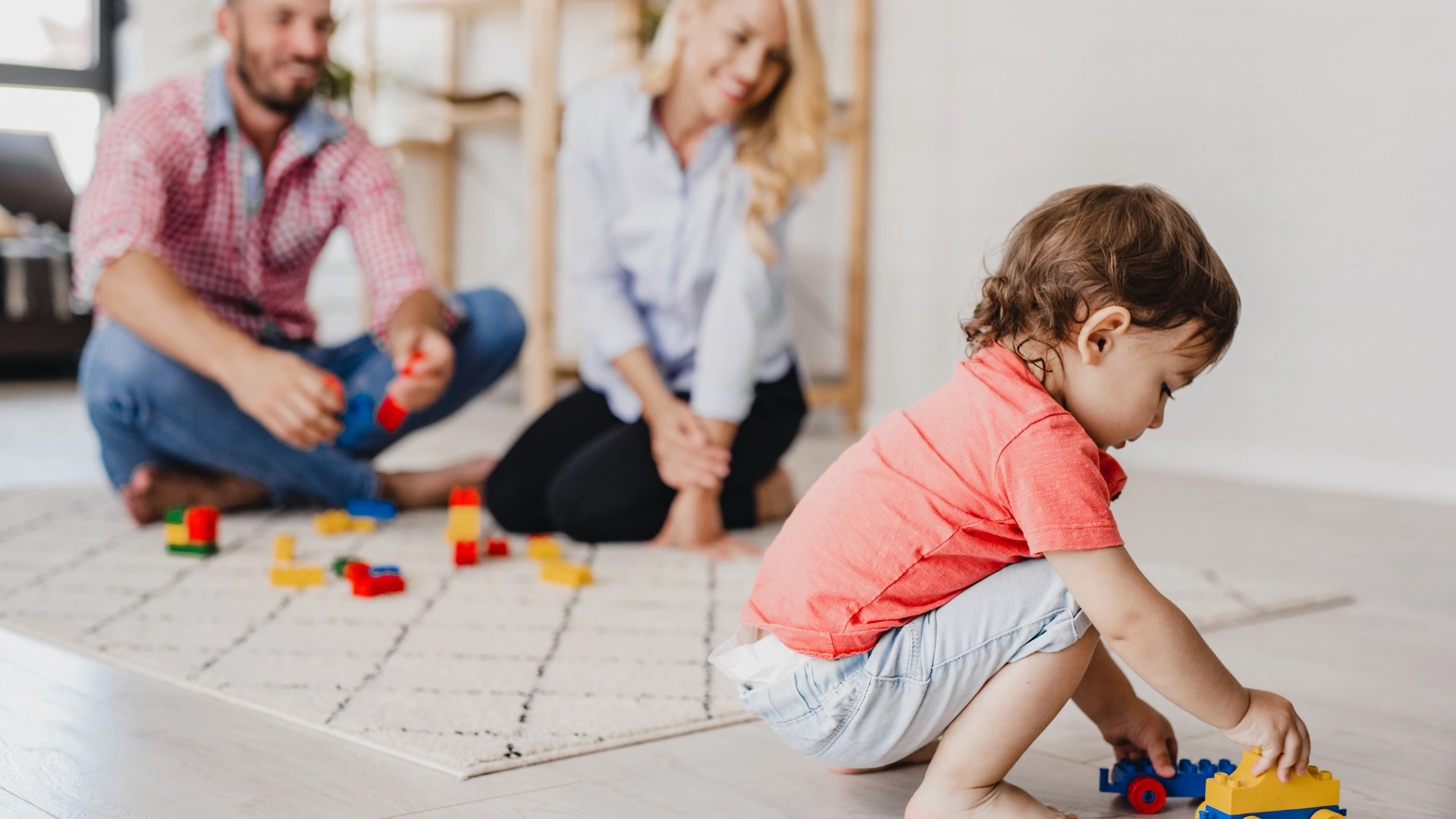 Toddler playing on a spotless floor in a Wesley Chapel home while parents watch